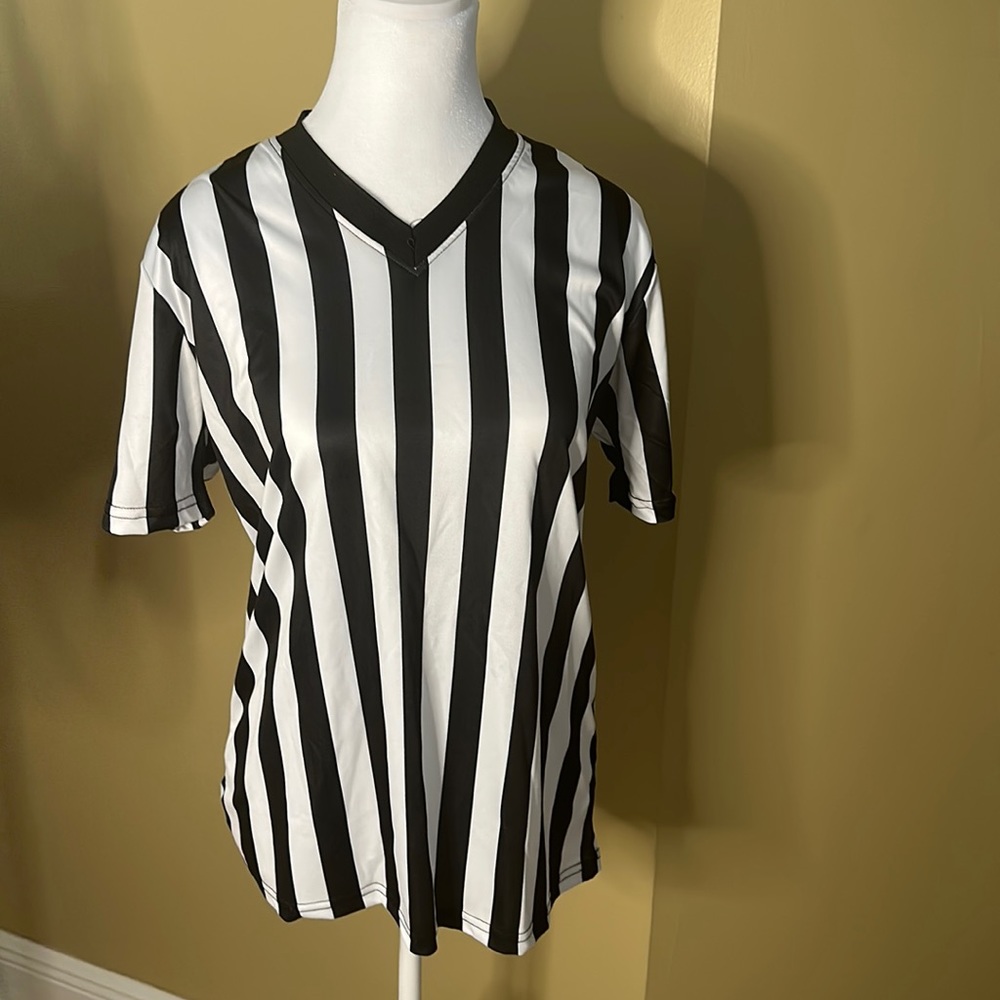 Brand new never worn ladies referee shirt with unopened whistle.